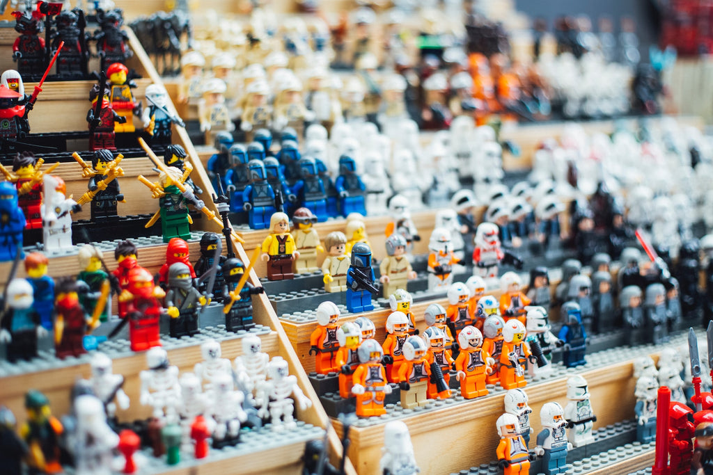 a big display of assorted star wars lego minifigures 