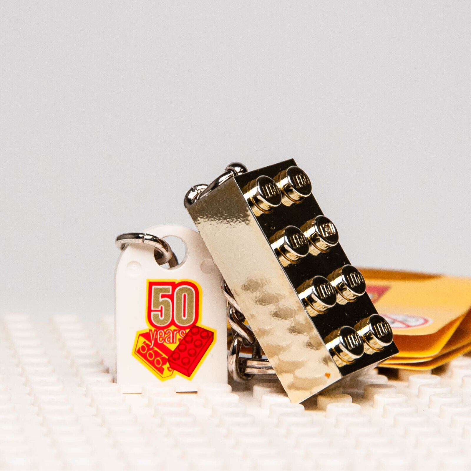 NEW Lego 50 years Anniversary Gold Brick Keychain -  2008 (852445) - StudBee