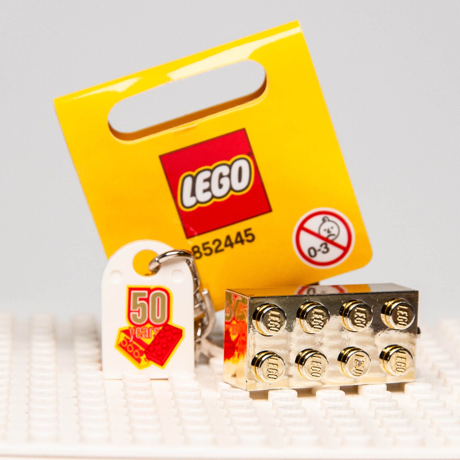 NEW Lego 50 years Anniversary Gold Brick Keychain -  2008 (852445) - StudBee