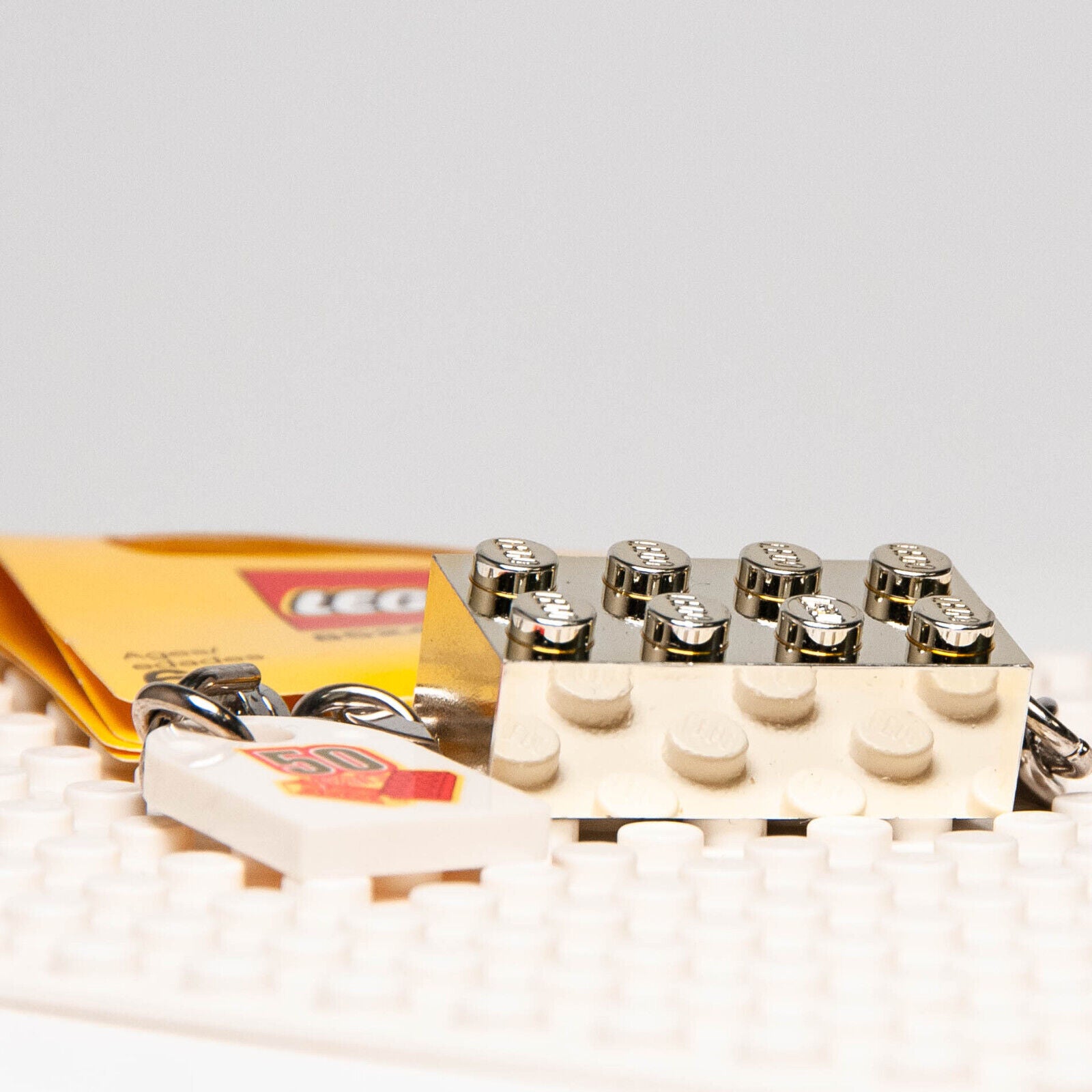 NEW Lego 50 years Anniversary Gold Brick Keychain -  2008 (852445) - StudBee