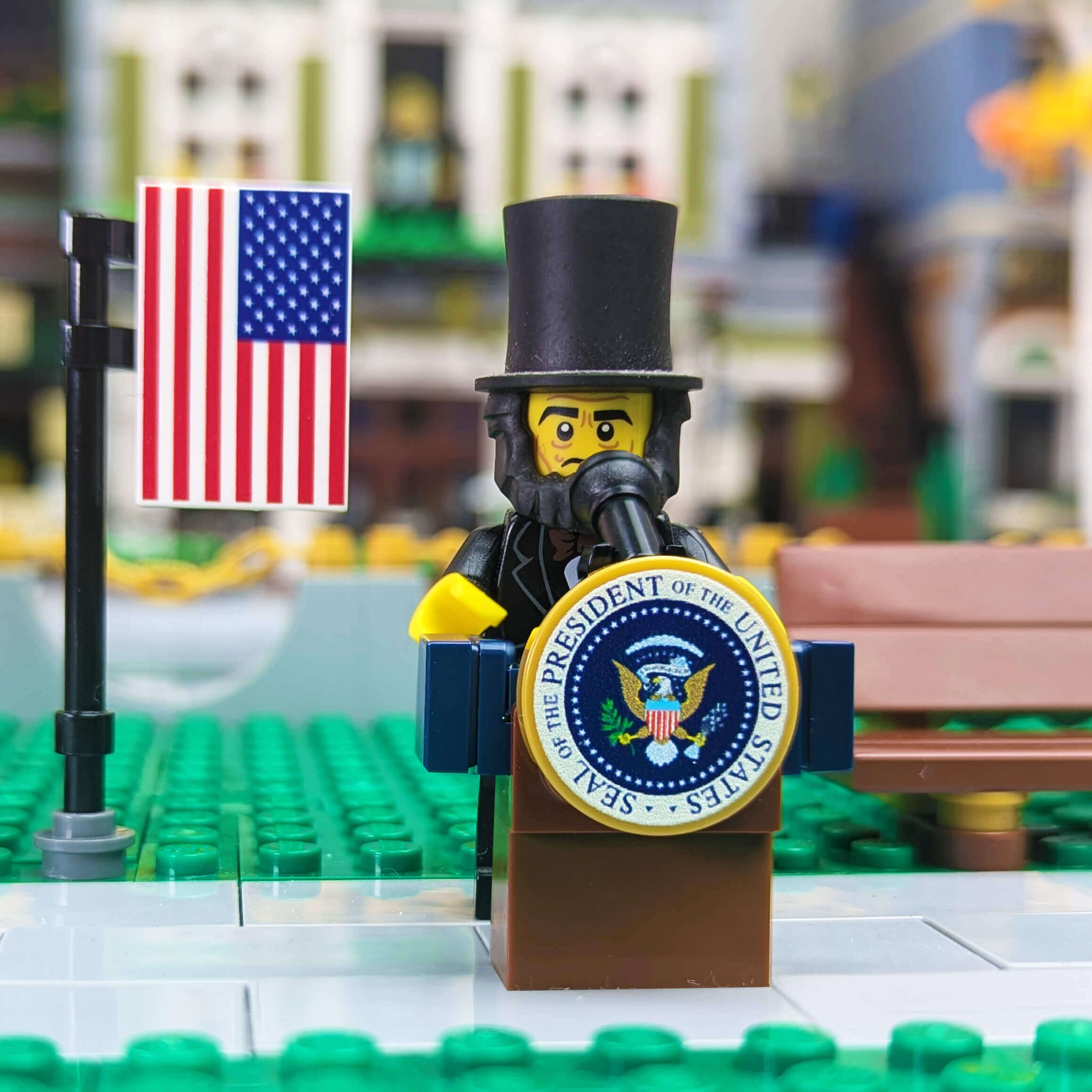 LEGO minifigure of a president with an American flag on a blurred store background