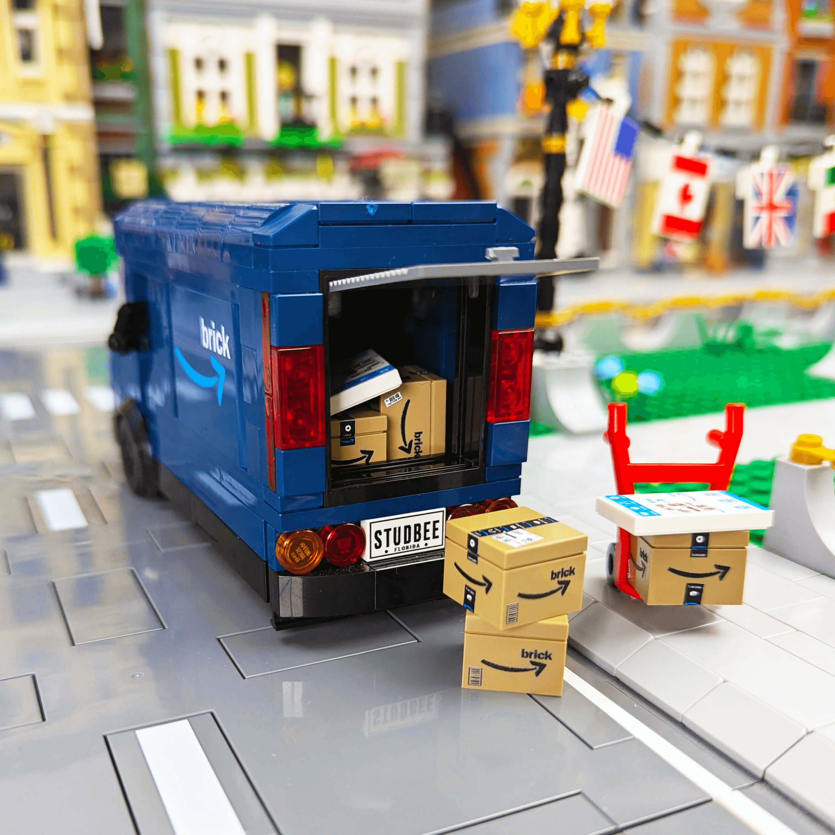 Toy truck made with LEGO® with boxes on a detailed city street model