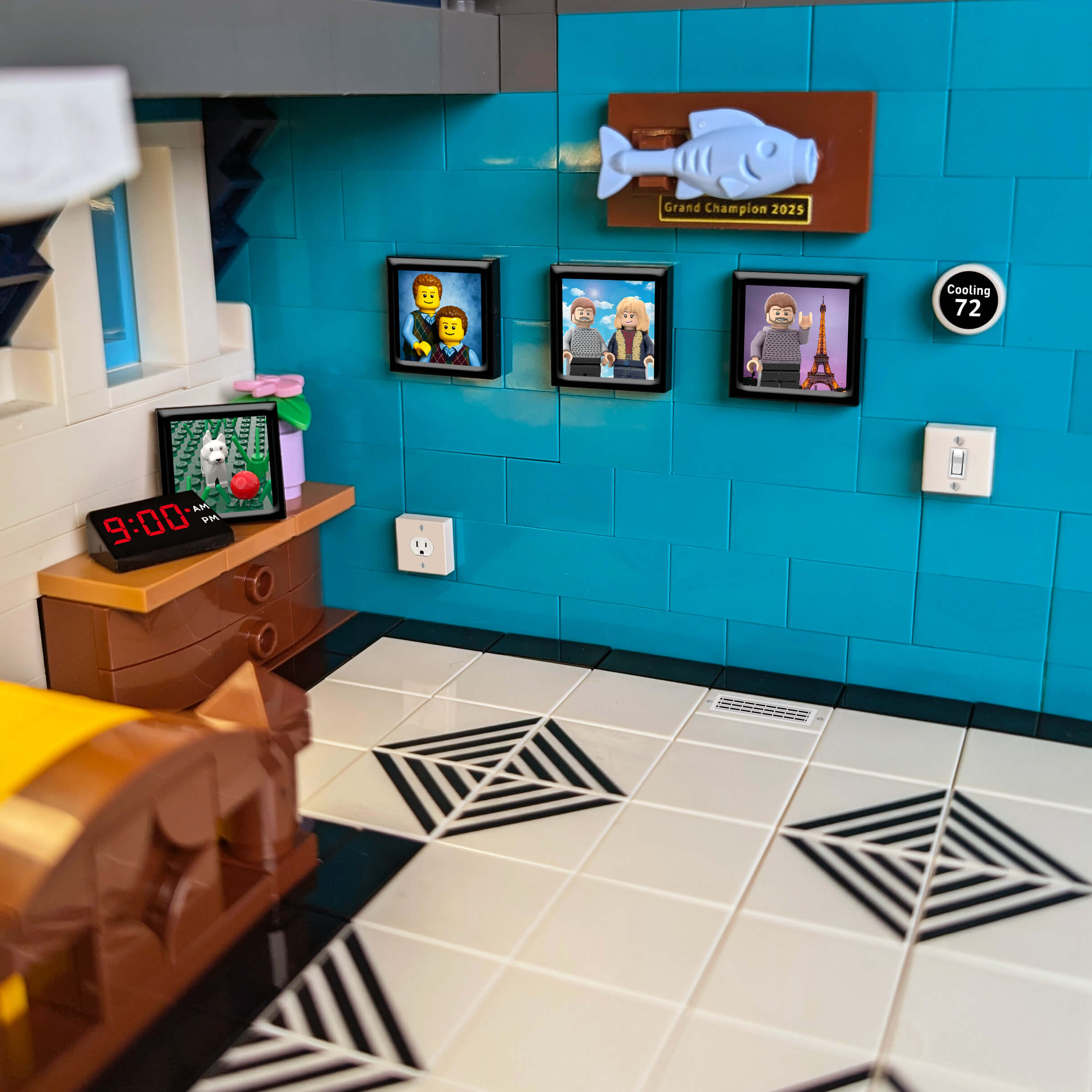 Brick room setup with blue wall, tiled floor, and framed pictures.
