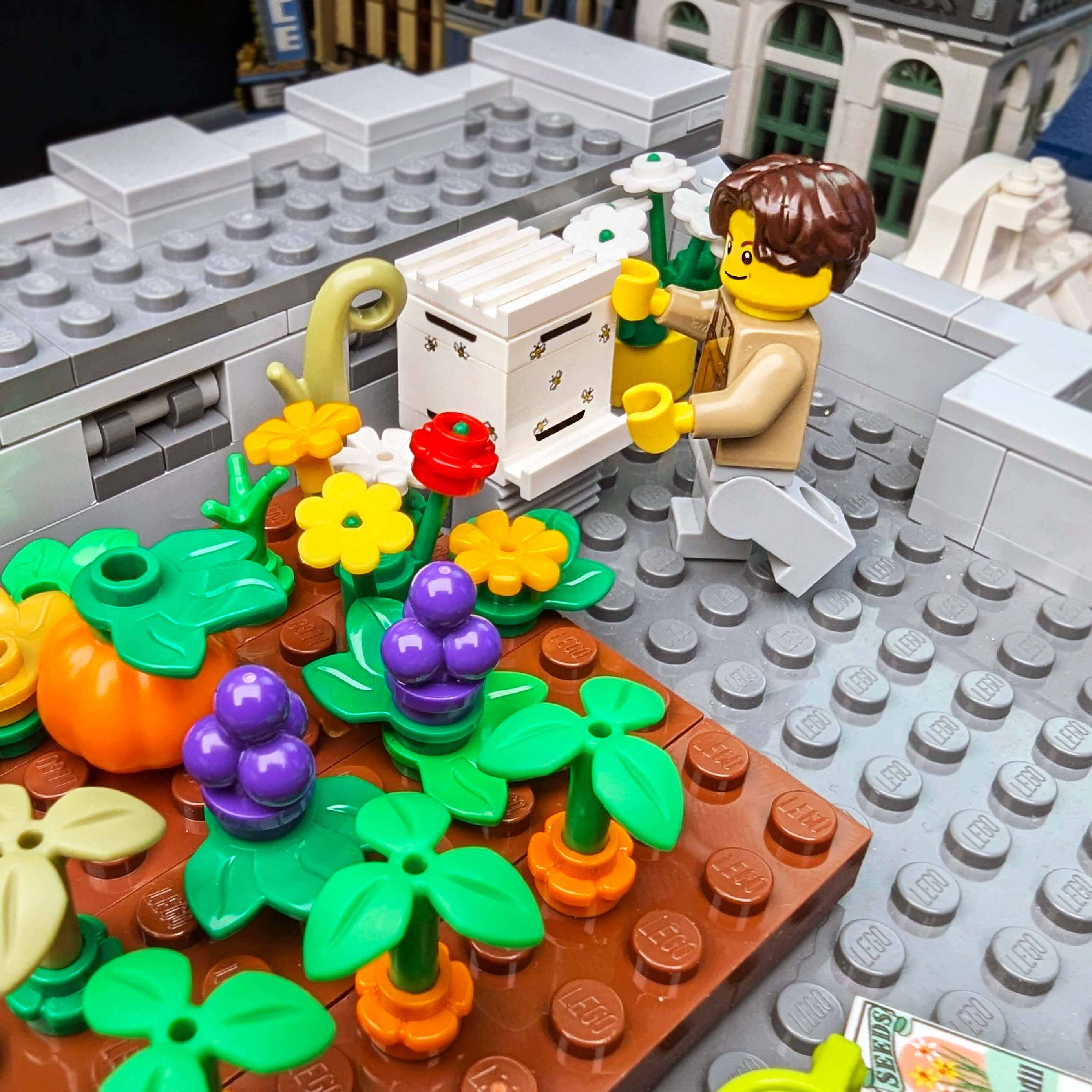 LEGO garden scene with a character tending to plants and flowers.