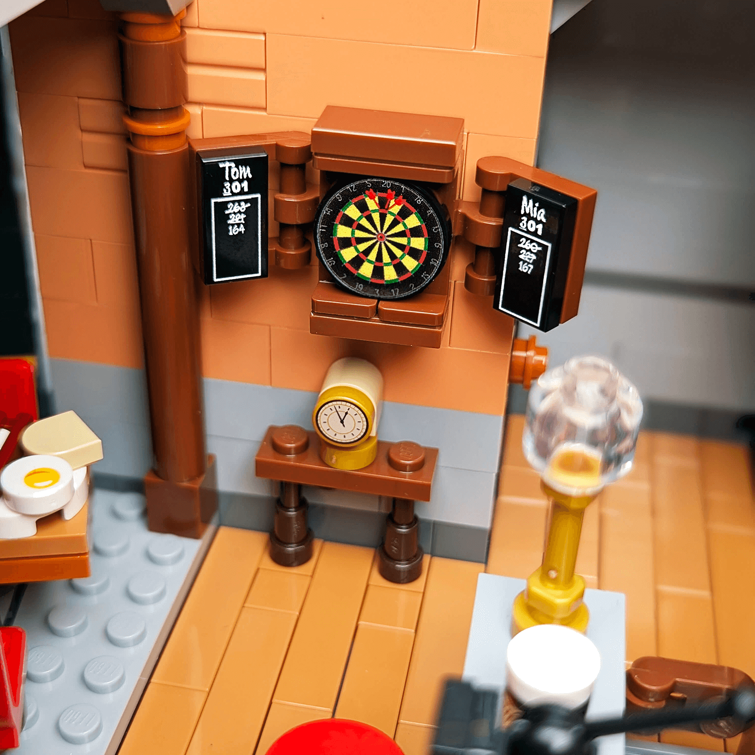 LEGO recreation of a bar with dartboard and bar counter