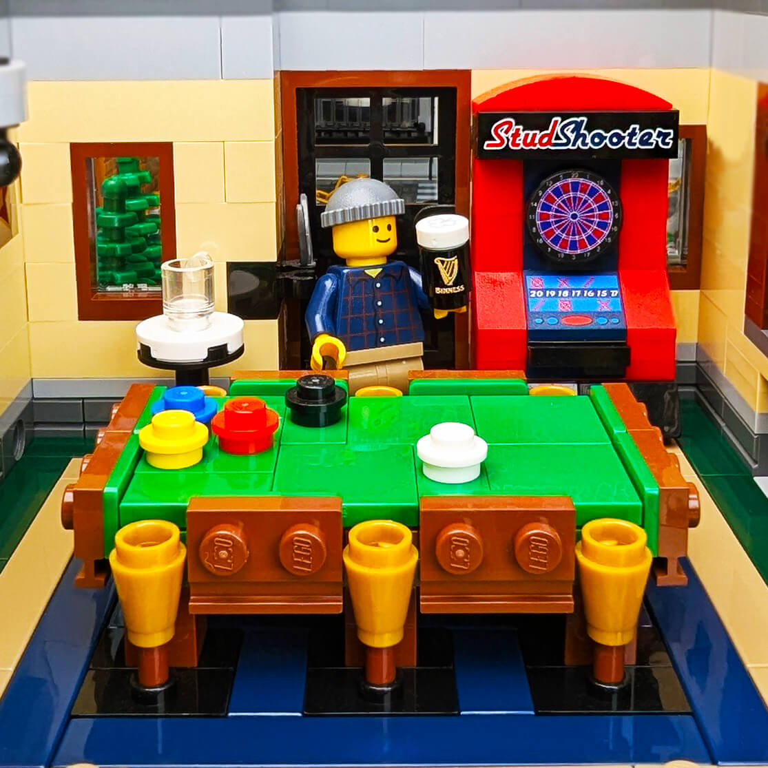Electronic Dart board and pool table with a minifigure holding a Binness beer