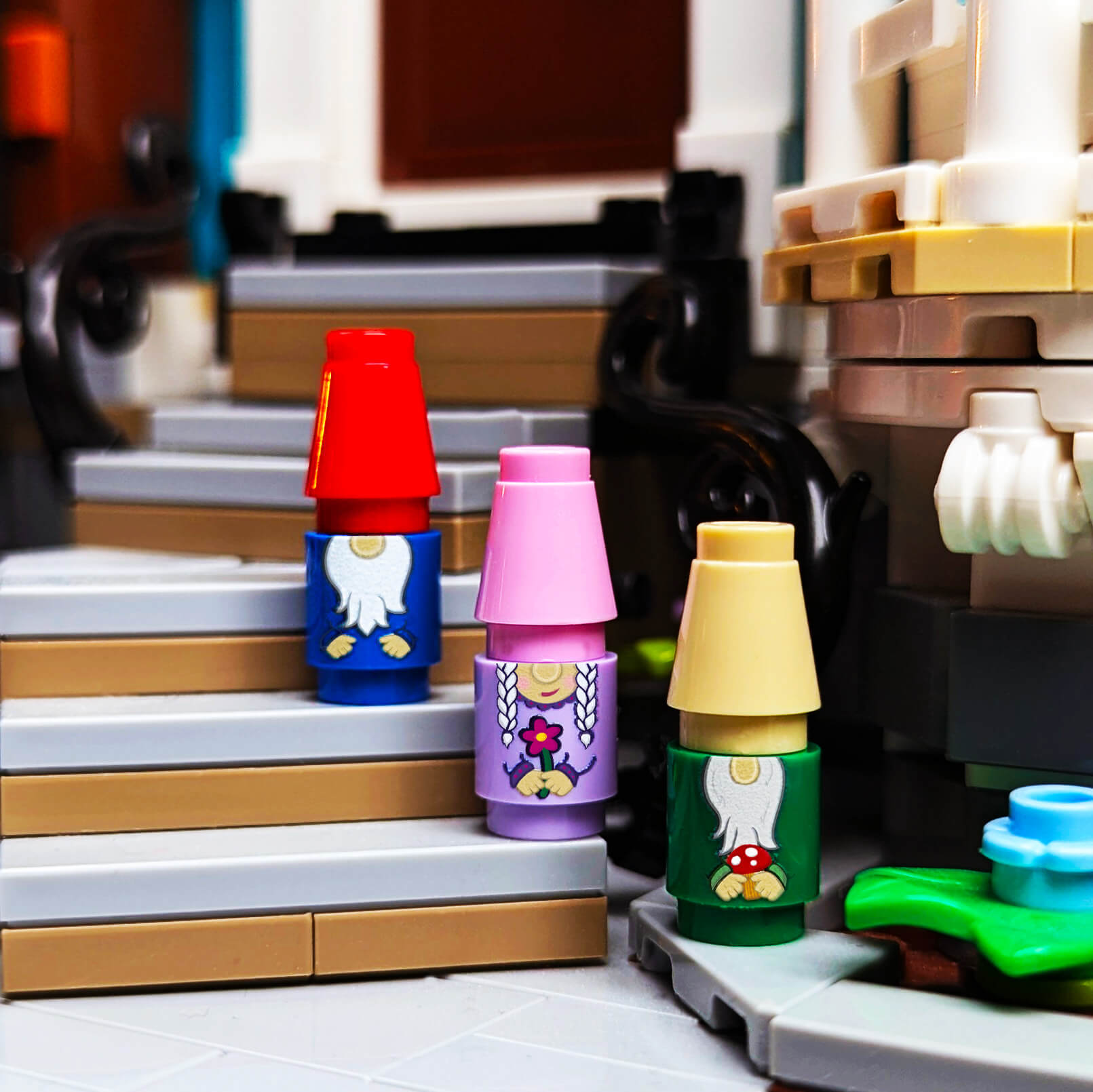 Three garden gnomes with custom printing, made with LEGO parts