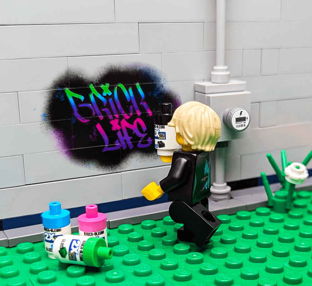 LEGO figure with spray paint can and graffiti on a brick wall background