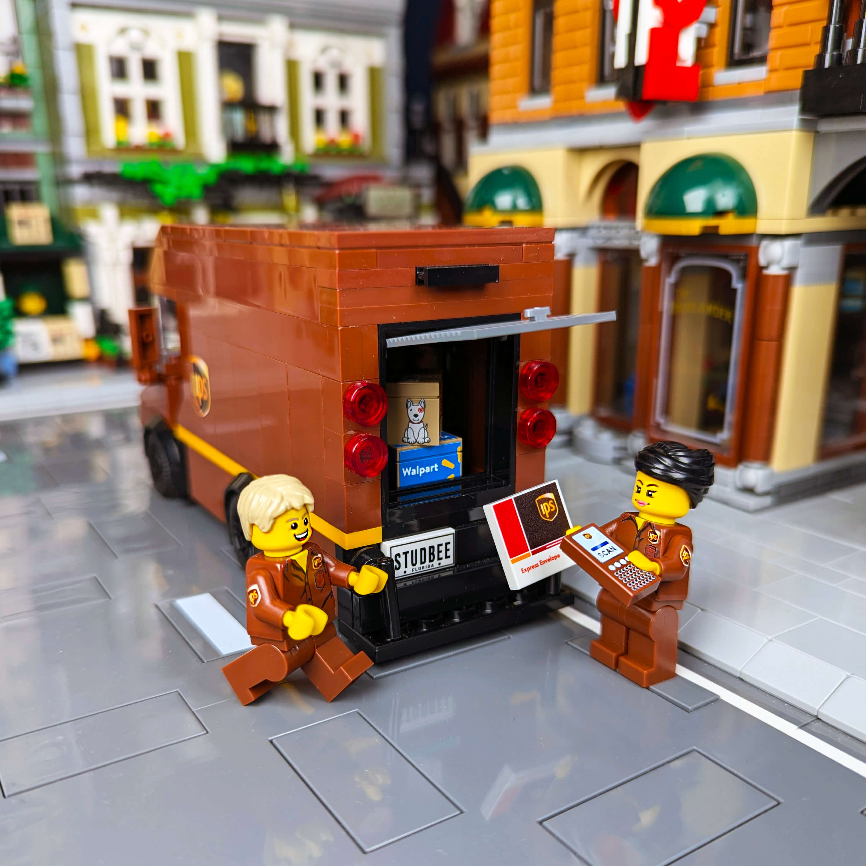 Custom Male and Female minifigures delivery drivers in brown uniforms, delivering packages from a brick built truck.