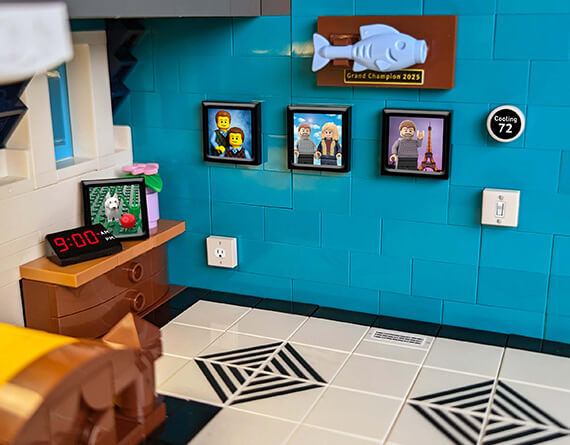LEGO MOC showing 11 custom lego studbee items, picture frames, power socket, light switch, alarm clock, custom lego floor tiles and more