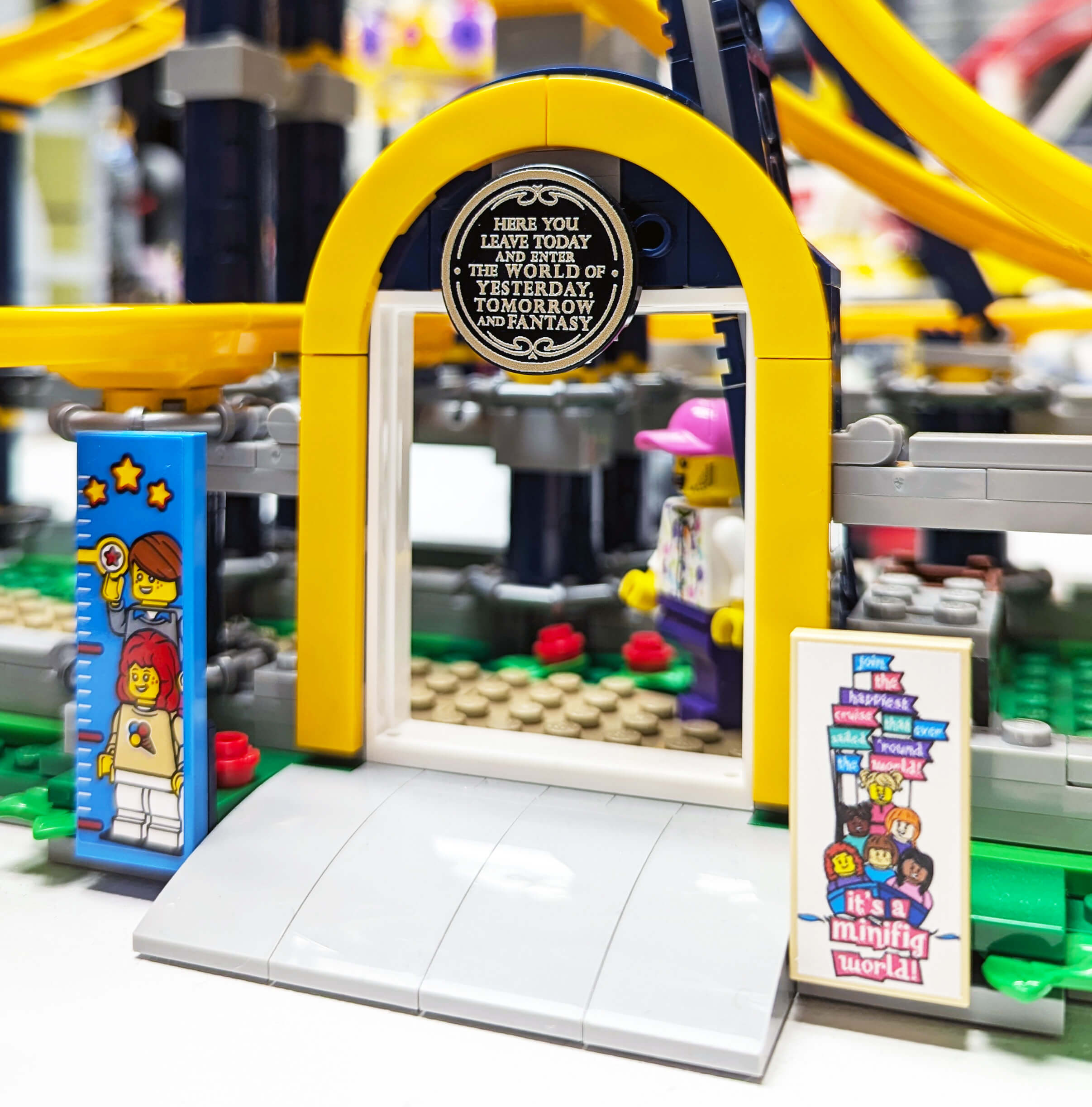 Close-up of a LEGO archway with characters and text, blurred background
