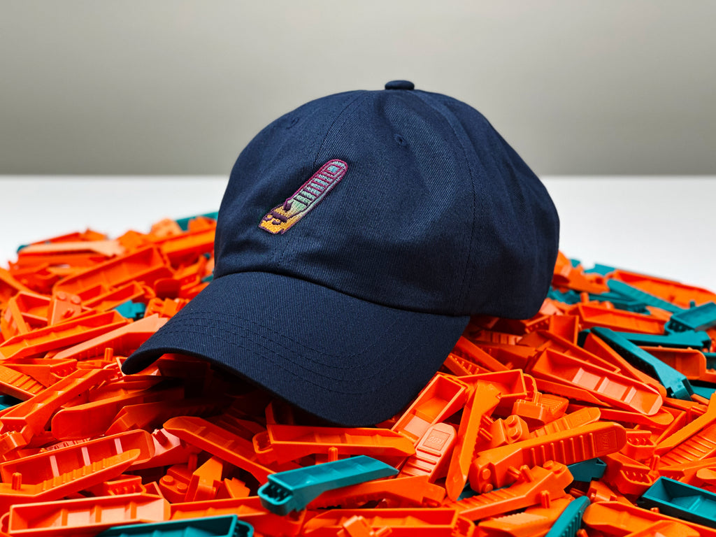 dad hat sitting over a pile of lego brick separators