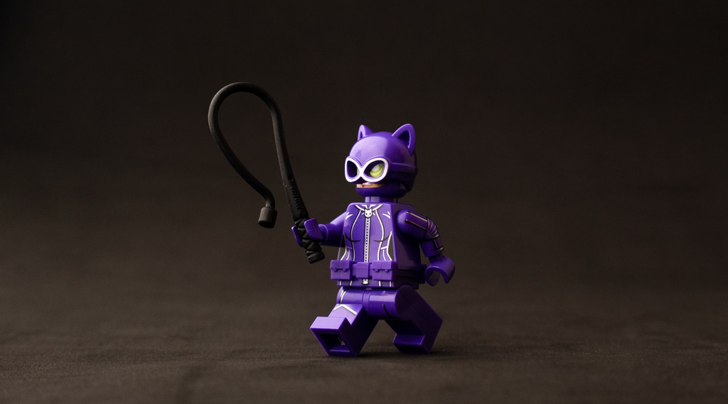 cat woman lego minifigure with a whip accessory