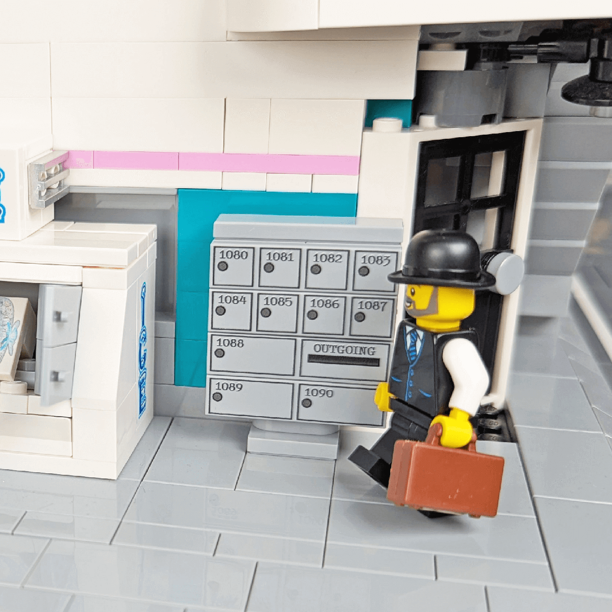minifig by a cluster mailbox