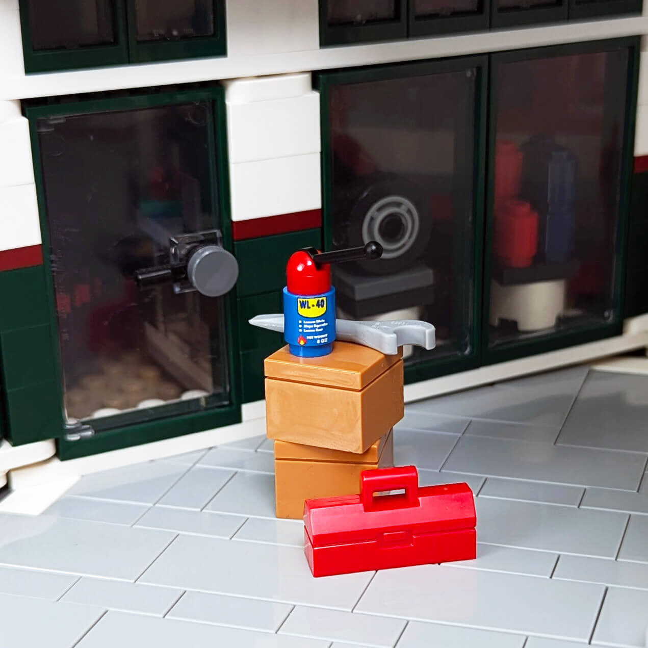 Custom LEGO WL-40 spray can, sitting on some LEGO boxes in a workshop type setting.