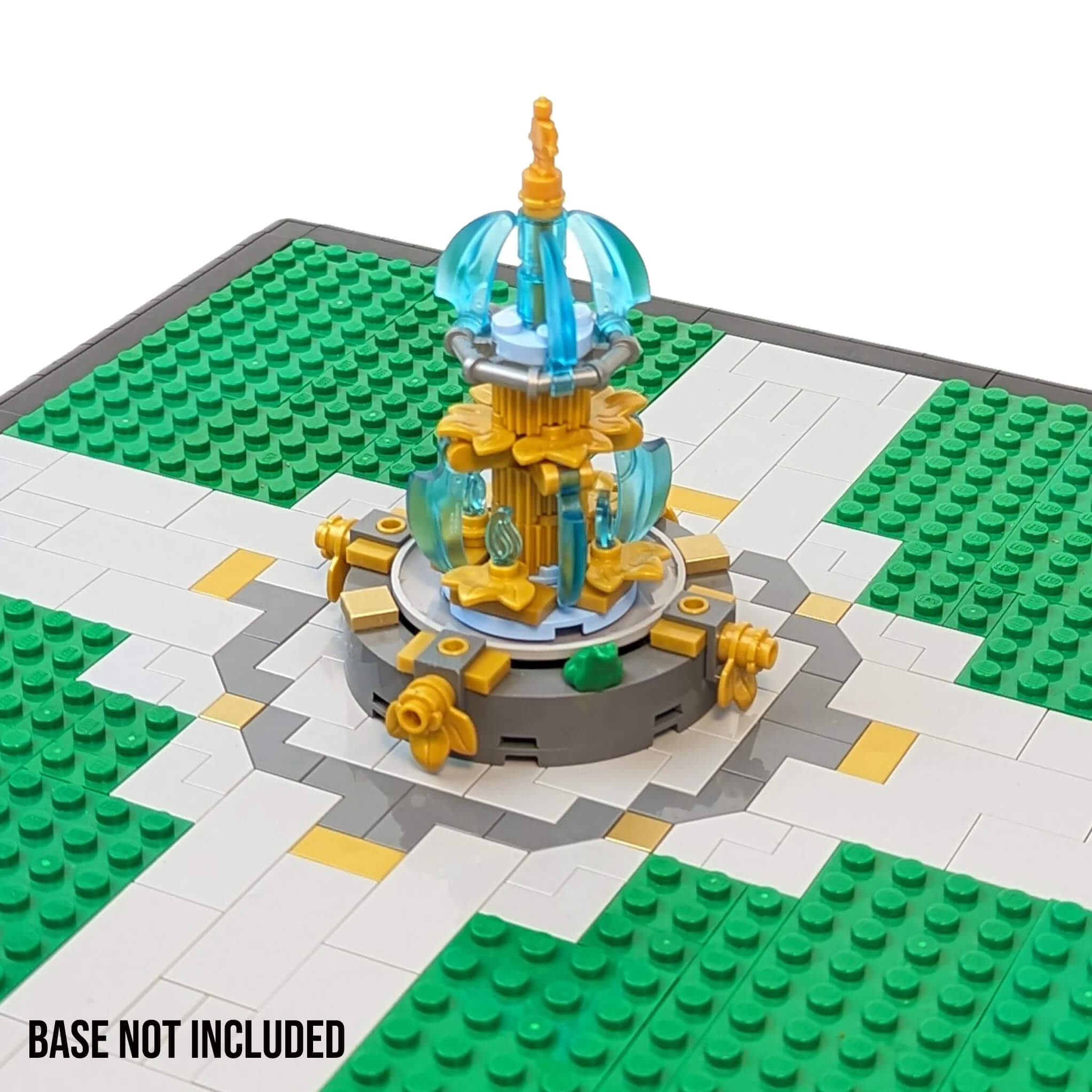 Custom building kit of LEGO of a park fountain with multiple level water falls gold statues and a frog on a grey base on a baseplate in a park setting white background