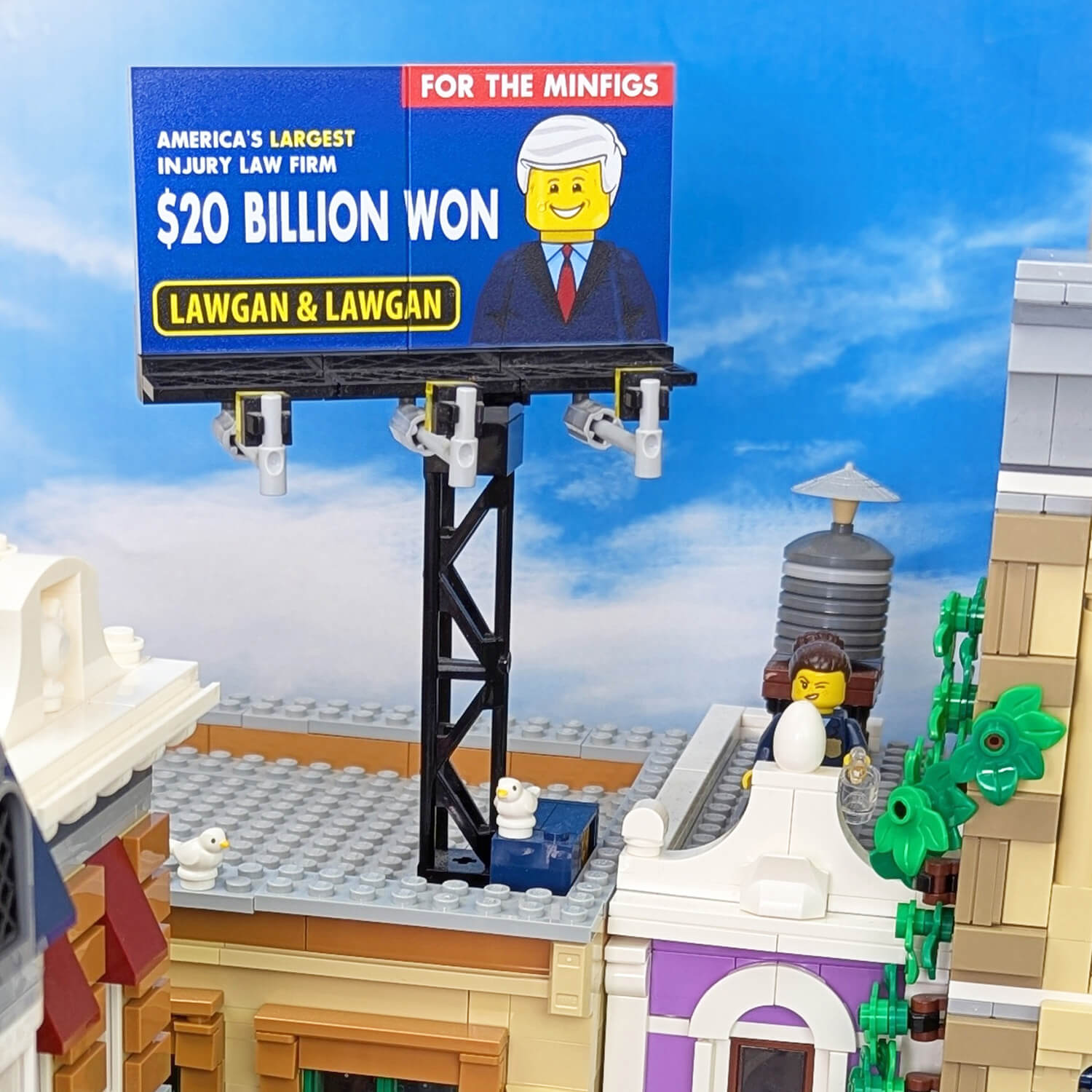 toy city scene with a injury attorney billboard on top of a building printed lego