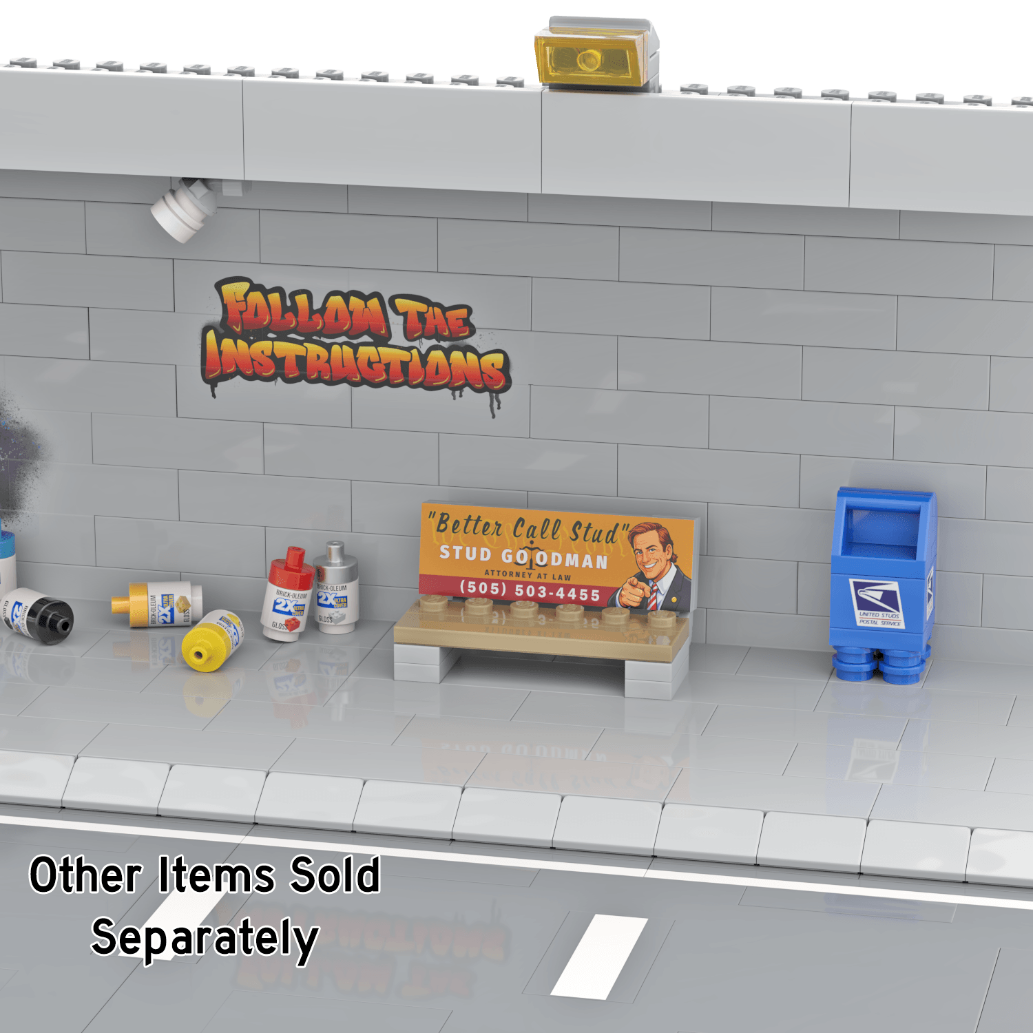 Custom LEGO brick built advertising bench and blue mailbox with a grey graffiti wall behind and empty spray paints on the side walk all in a LEGO city setting