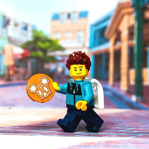 minifig holding a magical pretzel in a theme park