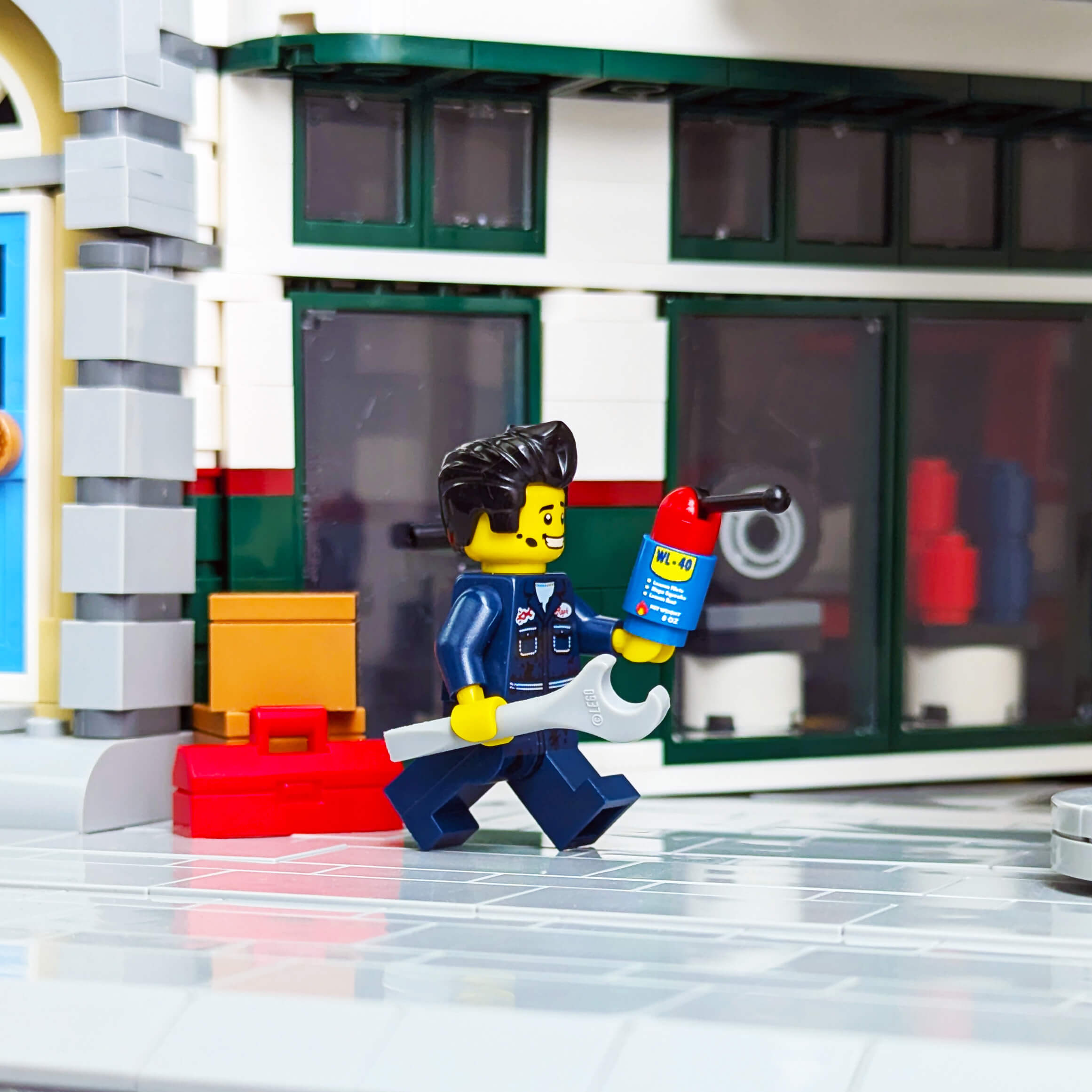 lego minifig in a garage setting holding a wl-40can and wretch