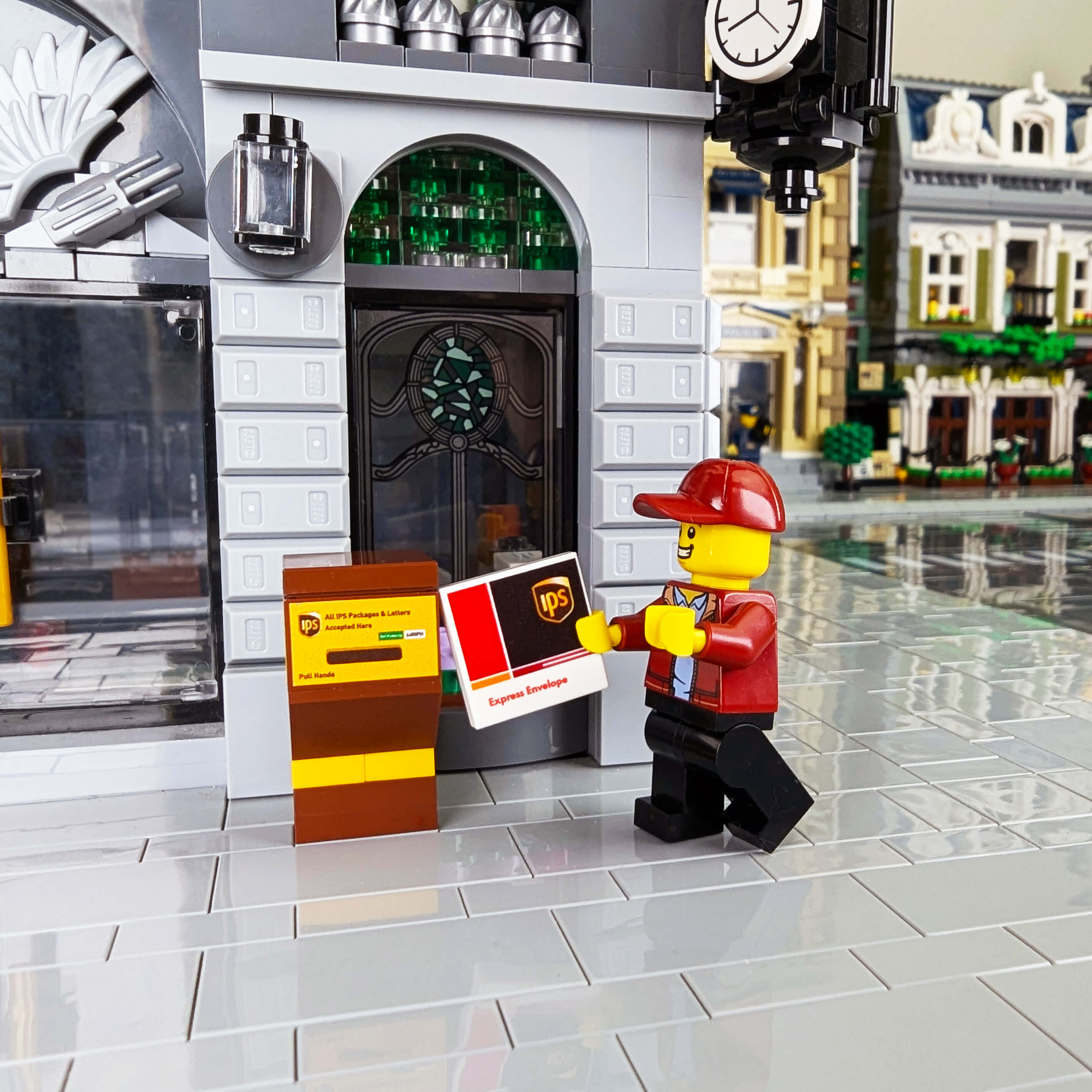 Minifig mailing a custom LEGO printed IPS package in a IPS Dropbox