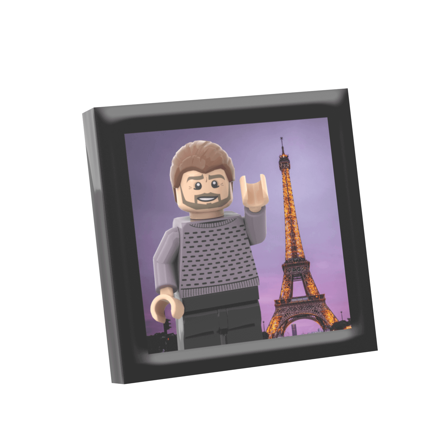 A framed travel picture featuring a LEGO minifigure in front of the Eiffel Tower.