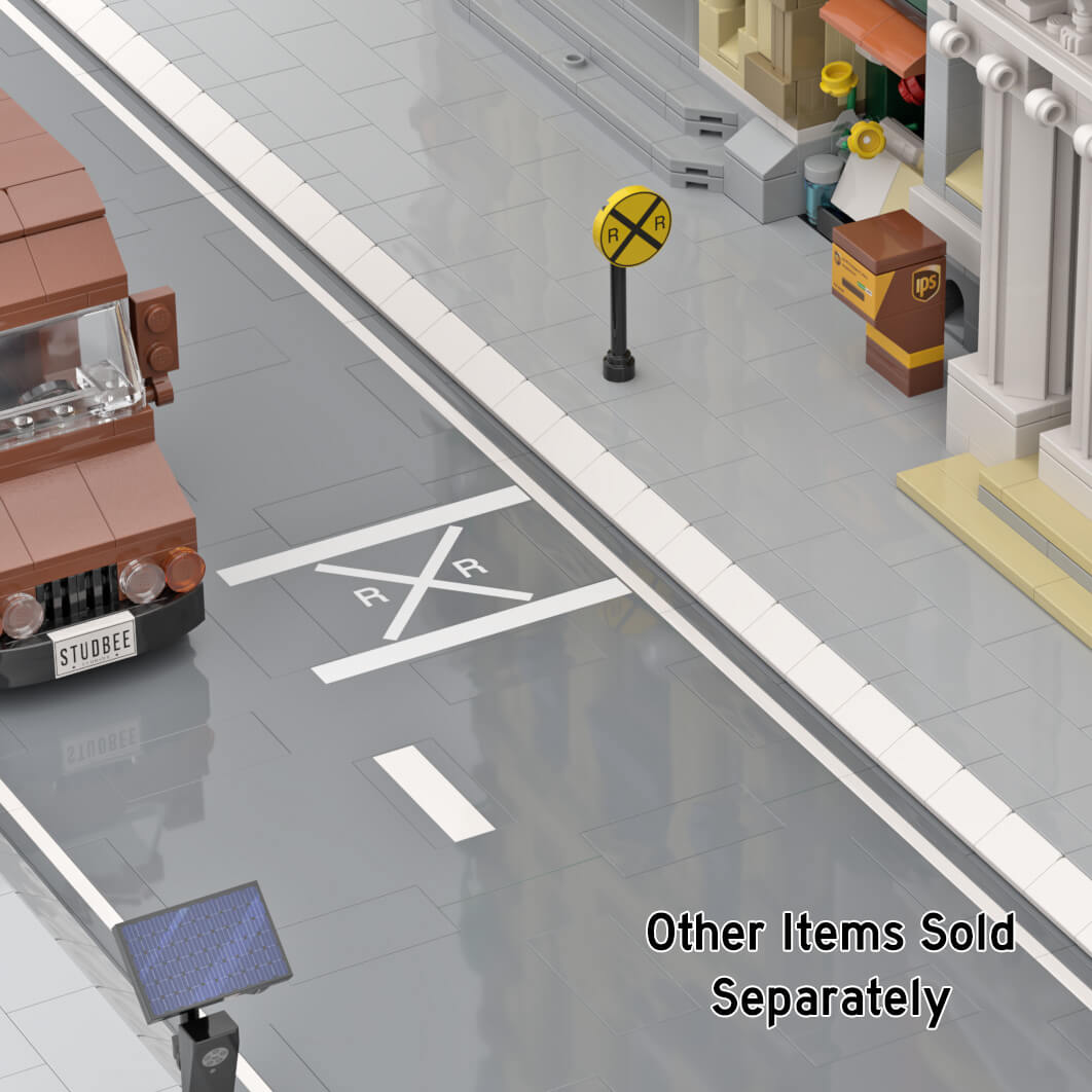 Railroad Street Marking in a LEGO city setting with buildings a Truck and RR street Sign.