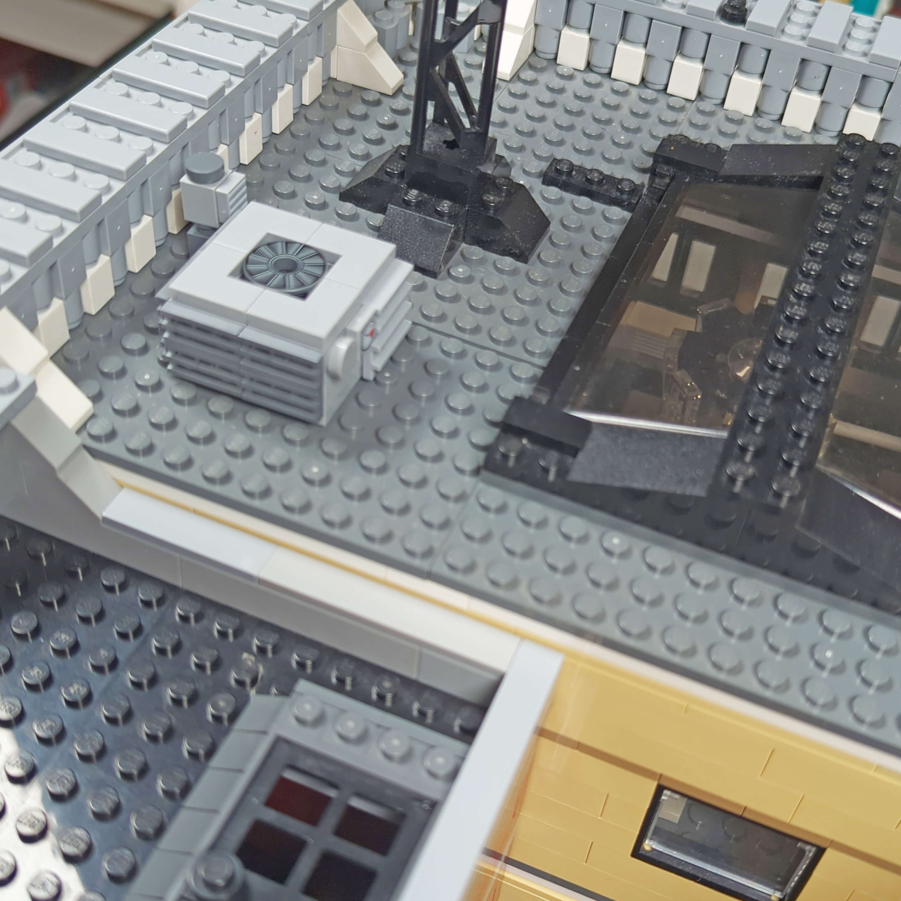 StudBee Custom AC unit model being shown on a LEGO modular buildings roof 