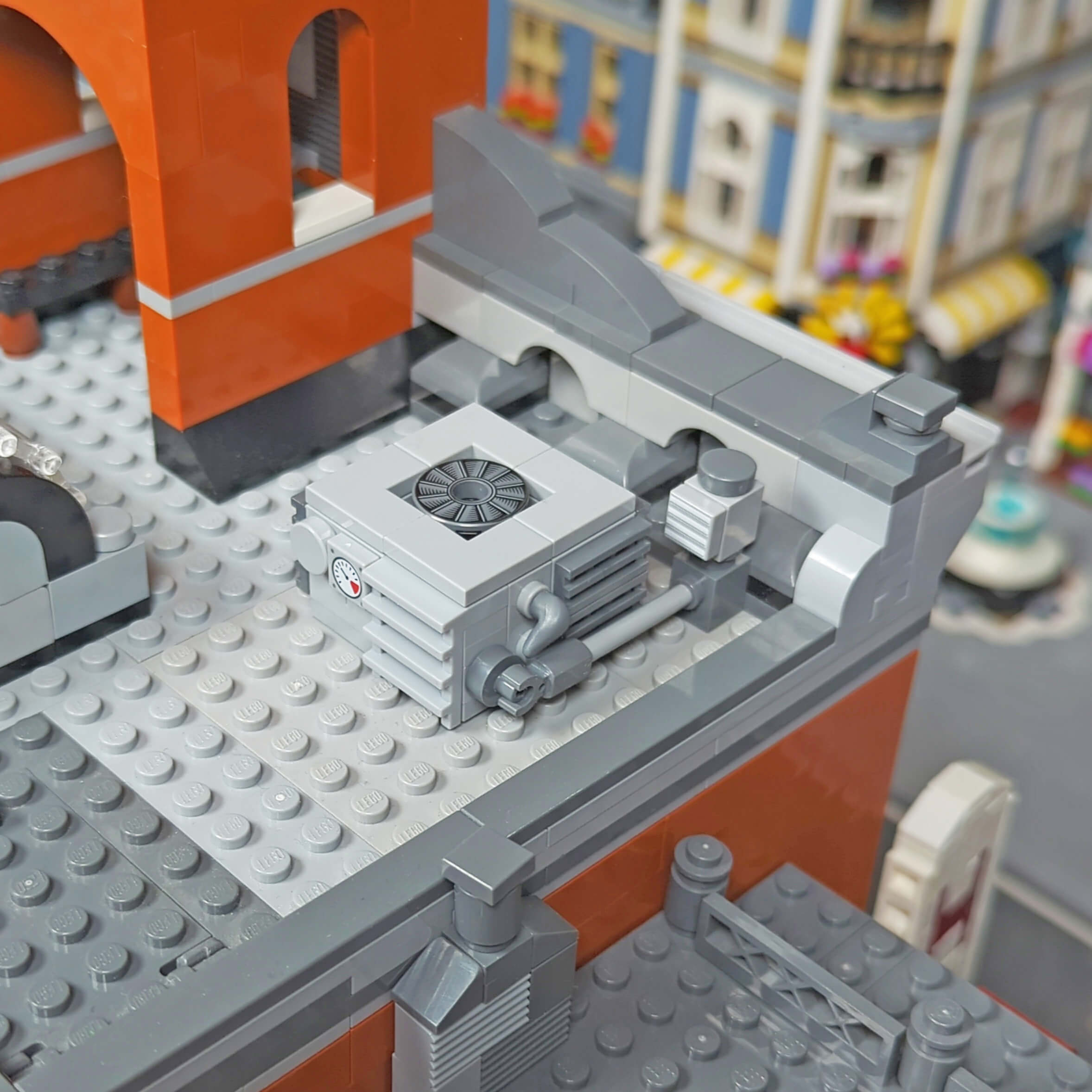 StudBee Custom AC unit model being shown on a LEGO modular buildings roof 