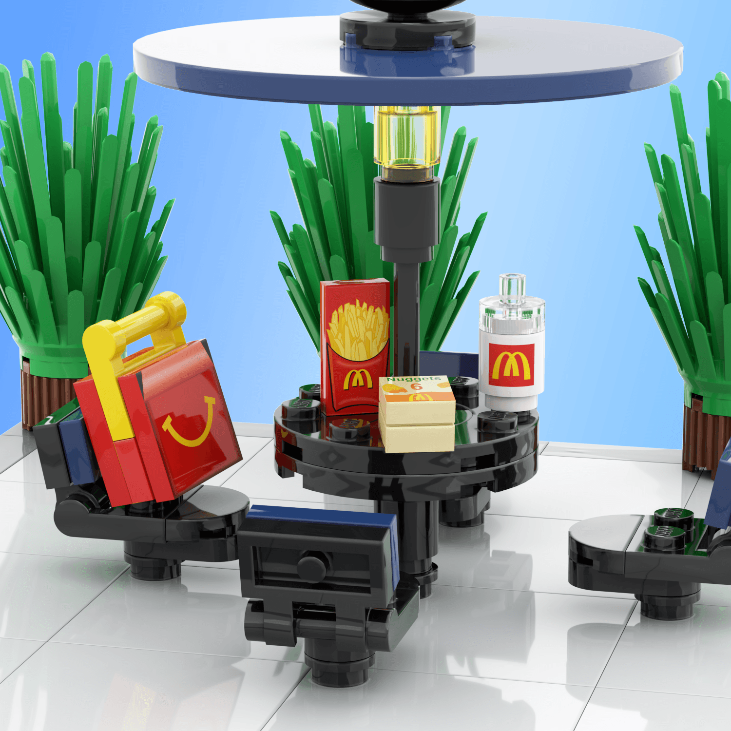 Black and blue picnic table, with mcbricks/mcdonalds kids meal, fries, mcnuggets,drink on the table with background plants on a light blue background.