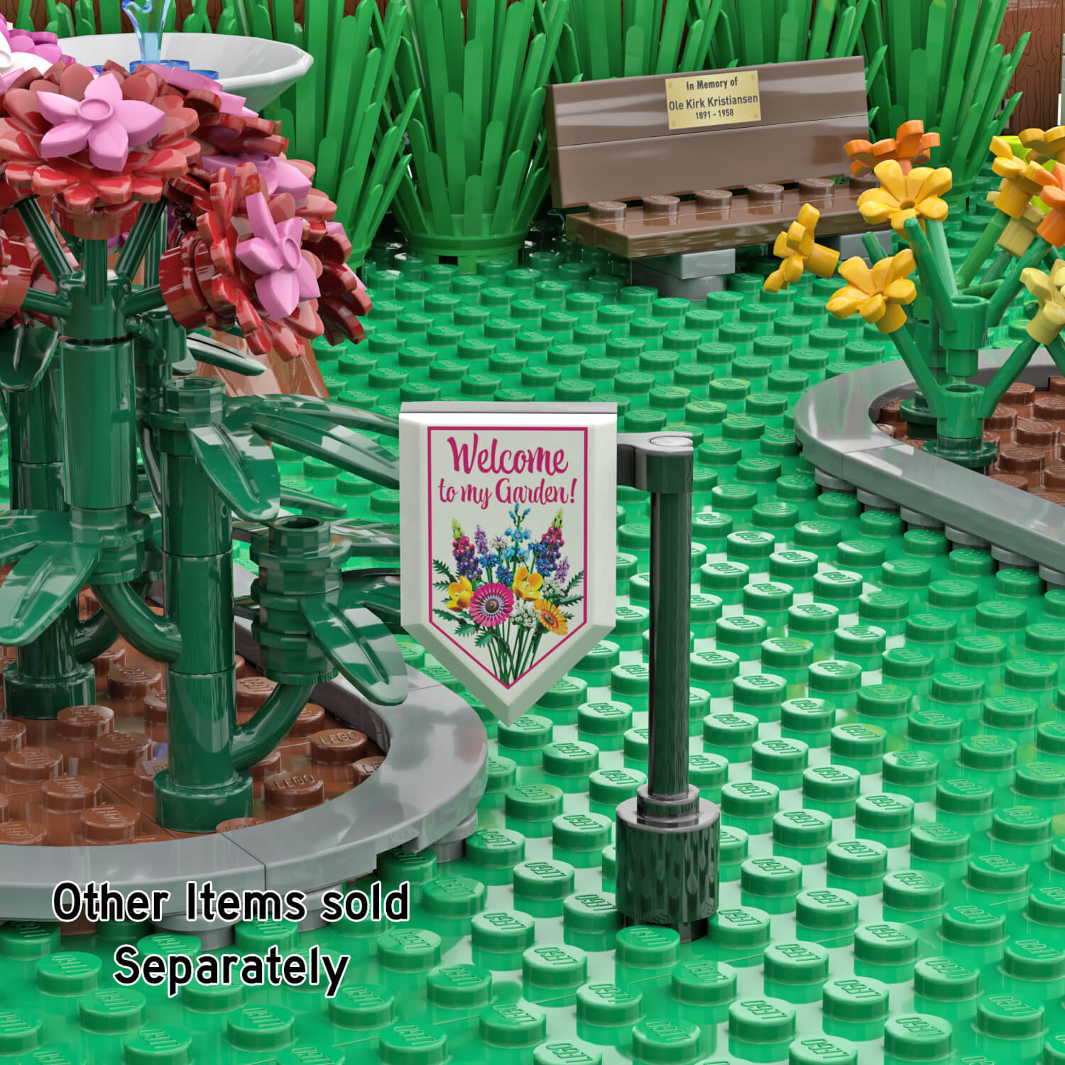 LEGO garden scene with red and yellow flowers, a brown bench, and a white 'Welcome to my Garden!' sign hanging from a black post on green baseplates.