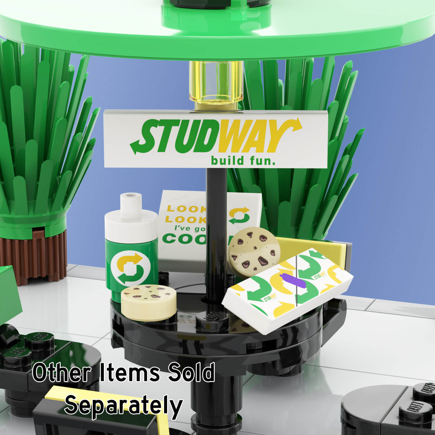 Custom designed LEGO studway food and drink, cookie pack and cookies, subway drink, and foot long sandwich on a black picnic table with a light blue background