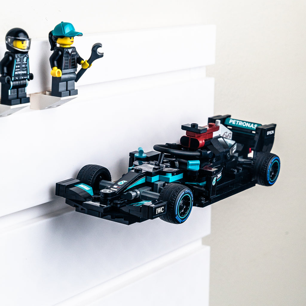 a wall mounted display of a Lego Mercedes Formula 1 Car